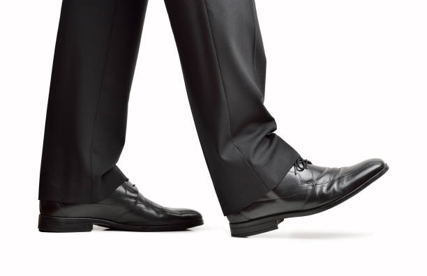 Close up of steps of a businessperson walking with isolated on white background SHOES COLLECTION2 - Image 1