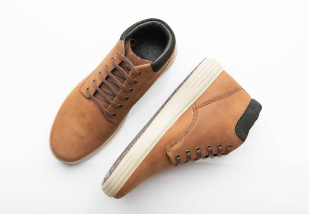 High resolution image of brown boots on white background shot in studio SHOES COLLECTION9 - Image 1